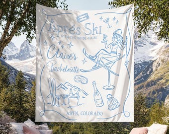 May include: A white fabric banner with light blue illustrations and text. The banner reads "Après Ski with the Bride-to-Be Claire's Bachelorette Aspen, Colorado." The design includes a skier, ski equipment, and cocktail glasses.