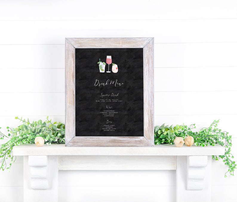 May include: A black chalkboard sign with a white wooden frame, displaying a drink menu with the title "Drink Menu". The menu lists "Sparkling Drink", "Wine", and "Beer" options. The sign is decorated with small watercolor illustrations of drinks.