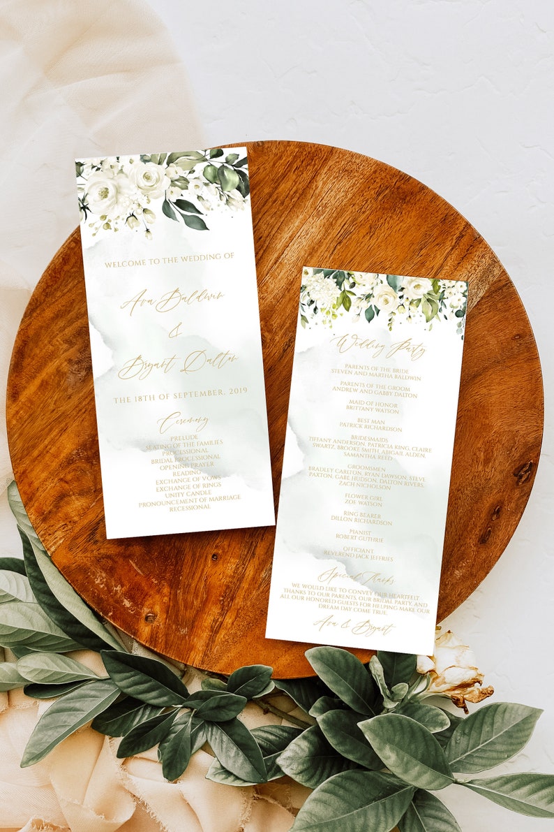 May include: Wedding ceremony program with white flowers and green leaves. The program includes the names Ava Baldwin and Bryatt Dalton, the date September 18, 2019, and a list of the ceremony events. The second program lists the wedding party members.