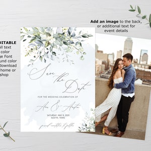May include: A save the date card with a watercolor floral design in shades of blue and green. The text reads "Save the Date" and "For the wedding celebration of An & Ansta" with the date and location below. The back of the card features a photo of a couple embracing in front of a city skyline.
