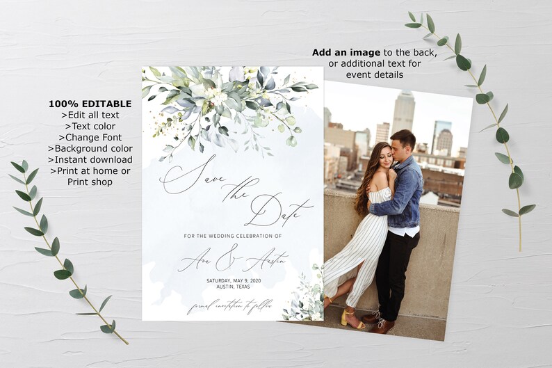 May include: A save the date card with a watercolor floral design in shades of blue and green. The text reads "Save the Date" and "For the wedding celebration of An & Ansta" with the date and location below. The back of the card features a photo of a couple embracing in front of a city skyline.