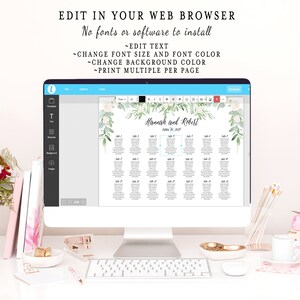 以下が含まれることがあります： コンピューターの画面に、結婚式用の座席表のテンプレートが表示されています。テンプレートは、白い背景に緑の葉と白い花が描かれています。チャートの上部には「Hannah and Robert」というテキストが表示されています。名前の下には「October 28, 2018」というテキストが表示されています。