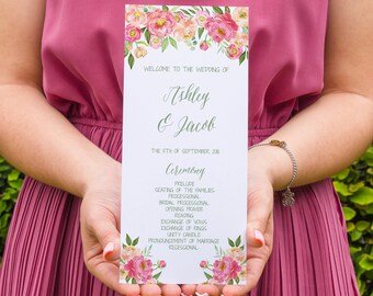 May include: A wedding ceremony program with a floral design featuring pink and peach flowers. The program lists the order of events for the wedding of Ashley and Jacob on September 5th, 2018.