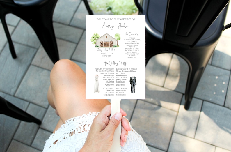 May include: A wedding program fan with a watercolor illustration of a barn. The program lists the wedding ceremony and wedding party details, including the names of the bride and groom, the maid of honor, bridesmaids, groomsmen, and officiant. The text reads "Welcome to the Wedding of Audrey + Jackson", "The Ceremony", "Morgan Creek Barn", "Alber, Texas", "July 17, 2024", "The Wedding Party", "Parents of the Bride", "Parents of the Groom", "Maid of Honor", "Bridesmaids", "Groomsmen", "Flower Girl", "The Officiant", "Violinist".