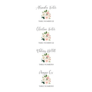 May include: Four floral table cards with names and table numbers. The cards feature a white background with pink and white flowers and green leaves.
