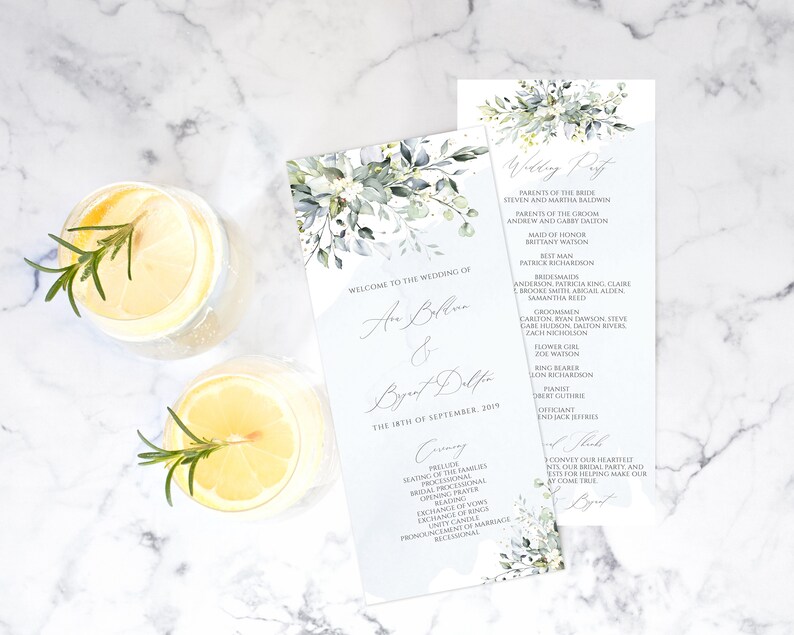May include: A wedding ceremony program with a watercolor floral design in shades of green and blue. The program includes the names of the bride and groom, the wedding date, and the order of events. The text "Welcome to the Wedding of" is at the top of the program.