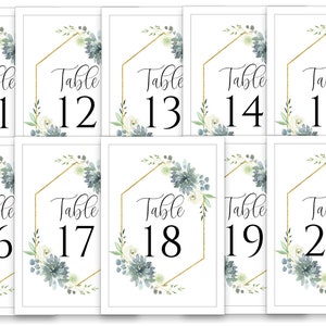 May include: Ten table number cards with a gold geometric frame and a watercolor floral design in shades of blue and white. The cards are numbered from 11 to 20.