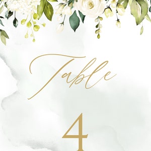 May include: White floral wedding table number card with gold calligraphy that says "Table 4".