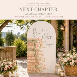 May include: A white arched backdrop sign featuring a stack of illustrated books in muted tones on the left side, adorned with soft pink floral accents. The text "Brooke's NEXT Chapter" is printed in a dark gray serif and script font.