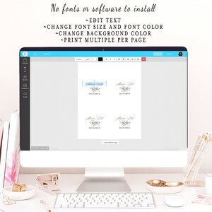 May include: A computer screen displaying a digital design template for table number cards. The template features a light blue background with a watercolor floral design and the text "Table Number 1". The text "No fonts or software to install" is displayed at the top of the screen.