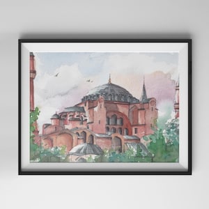 May include: Watercolour painting of the Hagia Sophia in Istanbul, Turkey, framed in a black border. The artwork depicts the iconic building in shades of red, pink, and grey, with a domed roof and minarets. Green foliage frames the building.
