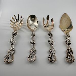 May include: A set of three ceramic mugs with a speckled, matte finish. The mugs are in shades of cream, light gray, and dark gray. Each mug has a simple, minimalist design and a rounded handle.