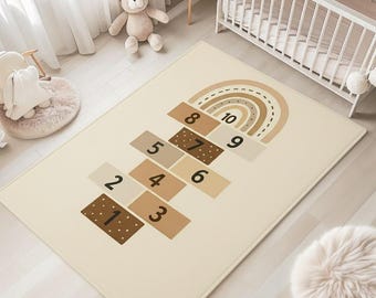 Beige regenboog hinkelend tapijt: leertapijt voor kinderen in de speelkamer