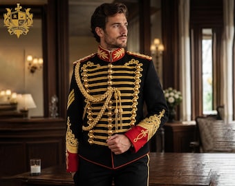 May include: A black military-style jacket featuring a high collar, red cuffs, and intricate gold embroidery. The front is adorned with horizontal gold braided cord detailing, gold buttons, and a decorative gold aiguillette cord across the chest.
