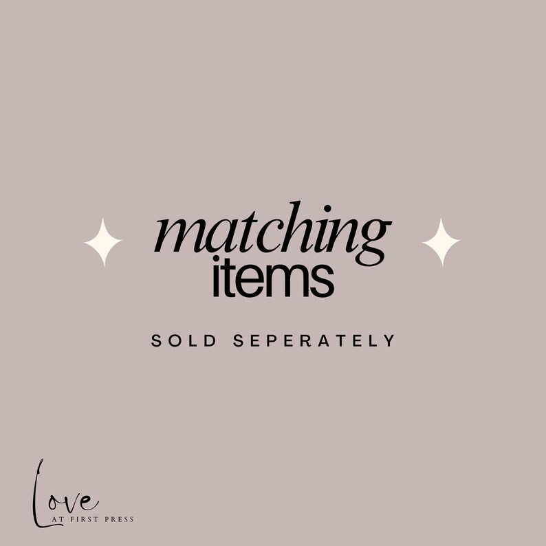 May include: A light mauve graphic with black text that reads matching items, followed by the text SOLD SEPERATELY in all capital letters. Two white four-pointed star icons are positioned on either side of the main text. The logo Love AT FIRST PRESS is in the bottom left corner.