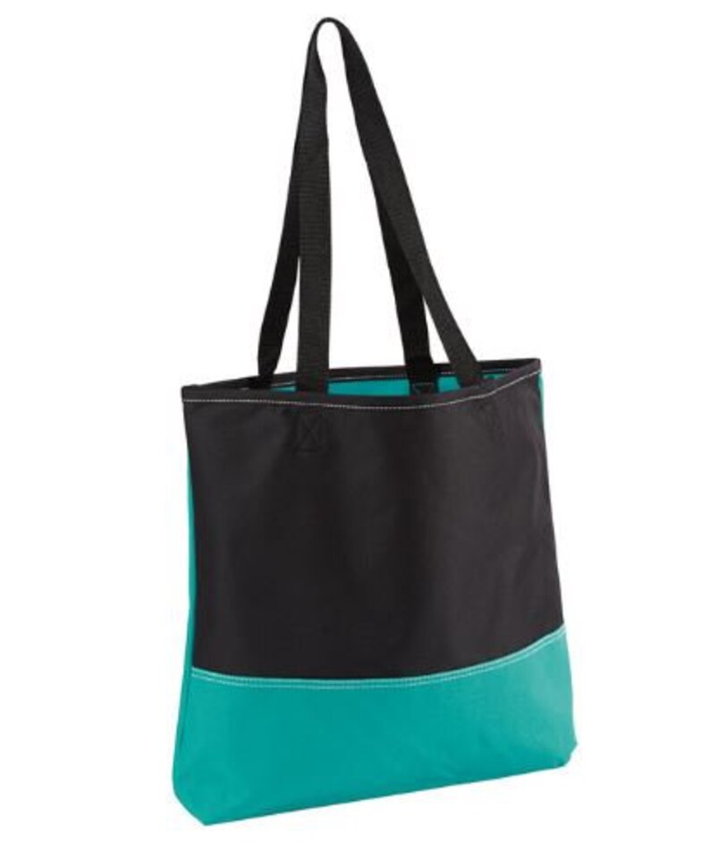 Puede incluir: Una bolsa de mano negra y turquesa con dos asas negras. La bolsa tiene una secci&oacute;n superior negra y una secci&oacute;n inferior turquesa.