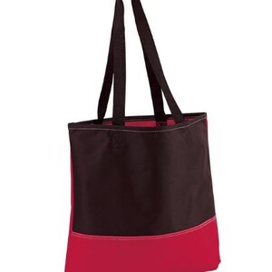 Puede incluir: Una bolsa de lona negra y roja con dos asas negras. La bolsa tiene una secci&oacute;n superior negra y una secci&oacute;n inferior roja.