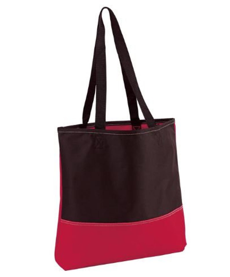 Puede incluir: Una bolsa de lona negra y roja con dos asas negras. La bolsa tiene una secci&oacute;n superior negra y una secci&oacute;n inferior roja.