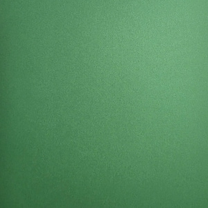 May include: A solid, flat, and uniform surface featuring a vibrant, medium-toned green color. The texture appears smooth with a subtle, consistent grain throughout, providing a clean and minimalist appearance across the entire visible frame.