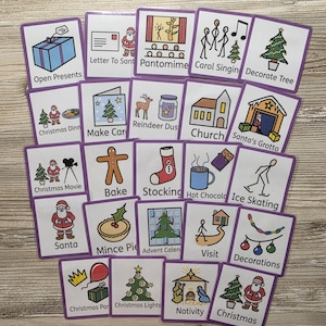 May include: A set of twenty-two square cards with purple borders, each displaying a colourful cartoon illustration and text related to Christmas activities, including Open Presents, Letter To Santa, Pantomime, Carol Singing, and Decorate Tree.