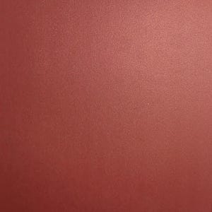 May include: A solid, flat sheet of paper or cardstock with a deep, muted red color. The surface has a subtle, fine-grained texture that is visible across the entire frame, creating a consistent, matte appearance without any patterns or designs.
