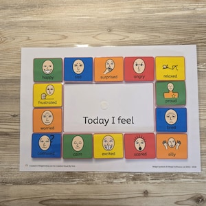 May include: An educational chart displaying various emotions, each represented by a coloured square and a facial expression. The phrase "Today I feel" is in the centre. Emotions include happy, sad, and excited. A resource for emotional understanding.