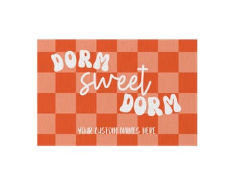 May include: A rectangular sign with an orange and white chequered pattern. The words "DORM Sweet DORM" are in white, playful lettering. The text "YOUR CUSTOM NAMES HERE" is below the main text, for customisation.