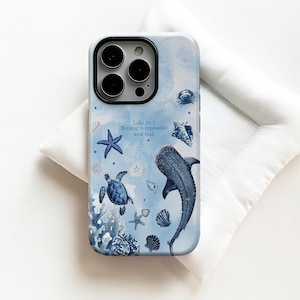 May include: A light blue phone case featuring an ocean-themed design. The case has illustrations of a whale shark, sea turtles, starfish, and seashells. The text "Luke 31:1 Nothing is impossible with God" is also included.