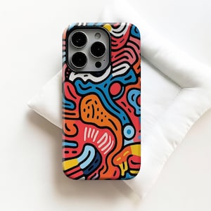 May include: A colorful phone case with a vibrant abstract design. The case features a mix of red, blue, orange, and yellow lines and shapes, creating a dynamic and eye-catching pattern. The case is designed to fit a smartphone.