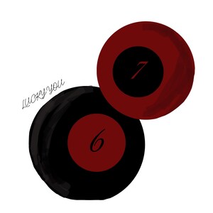 May include: Illustration of two billiard balls, one black with a red center showing the number 6, and one red with a black center showing the number 7. The words "lucky you" are written in cursive.