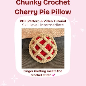 May include: A round, chunky crochet pillow designed to resemble a cherry pie. The pillow features a red filling with a tan lattice crust. The text on the image reads "Chunky Crochet Cherry Pie Pillow" and "PDF Pattern & Video Tutorial".