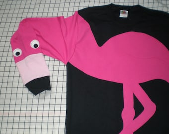 Long sleeve black tee shirt with an appliqued flamingo. Adult sizes small-xlarge.