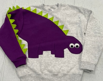 CLEARANCE Youth dinosaur shirt with purple dinosaur with green spikes. Size youth medium FREE US Shipping