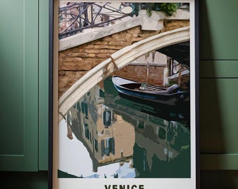 May include: A framed art print featuring a canal scene in Venice. The artwork depicts a bridge, a boat, and building reflections in the water. The word "VENICE" is printed in white at the bottom of the frame. The color palette includes shades of green, brown, and blue.