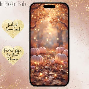 May include: A smartphone displaying a digital wallpaper featuring a collection of light pink pumpkins resting on a bed of fallen autumn leaves under glowing trees. The text In Bloom Babe, Instant Download, and Perfect Size for Your Phone is visible.
