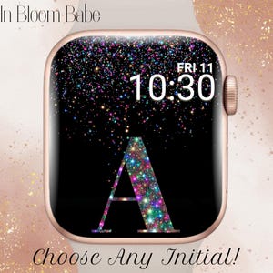 May include: A rose gold smartwatch with a digital display featuring a black background, multicolored glitter falling from the top, and a large letter A filled with the same glitter. The screen shows the time 10:30 and date FRI 11. Text reads In Bloom Babe.