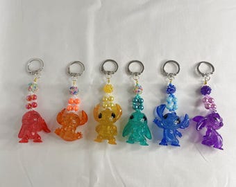 Llavero con cuentas y figura de punto de arcoíris para bolso