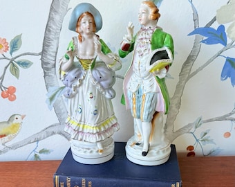 J.B. Betson’s China Porcelain Figurine Pair, Man and Woman in Colonial Period Dress