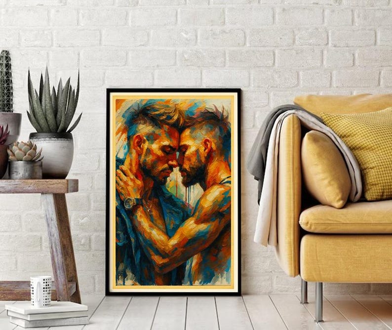 May include: A framed art print showing two men in an embrace, painted in vivid blues, oranges, and yellows. The artwork is set against a white brick wall, with a wooden stool and potted plants on the left and a yellow sofa on the right.