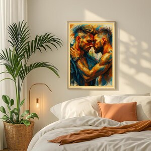 May include: A framed art print showing two men in an embrace, painted in vivid blues, oranges, and yellows. The artwork has a painterly style, with visible brushstrokes. The print is displayed in a bedroom setting, above a bed with white bedding.