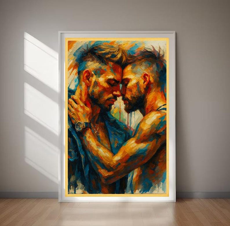 May include: An art print showing an abstract painting of two men in an embrace. The artwork uses a vibrant palette of blues, oranges, and yellows. One man wears a watch and a denim jacket. The painting is framed in a white frame with a gold border.