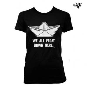 May include: Black women's t-shirt with a white paper boat graphic and the text "SS Georgie" and "We all float down here."