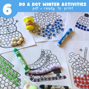 May include: Winter-themed dot marker activity sheets with a snowman, snowflake, Christmas tree, ice skates, and gingerbread man designs. Includes Play-Doh, dot markers, and dot stickers. The text at the top says "DO A DOT WINTER ACTIVITIES pdf • ready to print".
