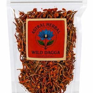 May include: A clear plastic resealable pouch filled with dried orange Wild Dagga flowers. A rectangular label on the front features a blue lotus illustration, the text ASTRAL HERBAL, WILD DAGGA, and the botanical name Leonotis leonurus.