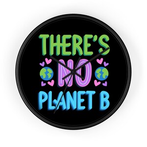 May include: A round wall clock with a black frame and a black face. The clock face features the text "THERE'S NO PLANET B" in green, pink, and blue, with heart and planet graphics.