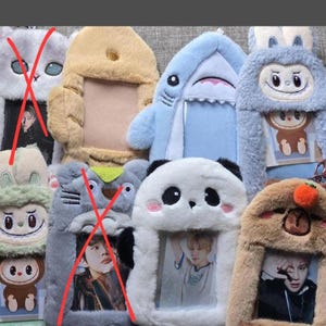 May include: A collection of plush animal-themed photo holders. Designs include a shark, panda, bunny, bear, and monkey. Each holder has a rectangular opening for a photo. The holders are made of soft, fuzzy materials in various colors.