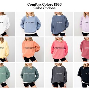 The image is a collage of 12 color options for a sweater, each with a different color and style. The options include white, blue jeans, denim, orchids, butter, terracotta, watermelon, Crimson, green, blue spruce, blue spruce, black, and black.