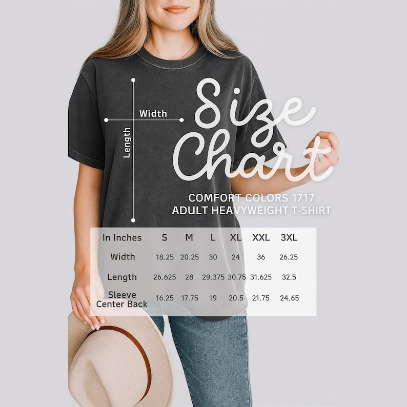 May include: A dark gray Comfort Colors adult heavyweight t-shirt with a size chart overlay. The chart provides measurements in inches for width, length, and sleeve center back for sizes S through 3XL. The shirt is being modeled.