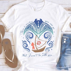 May include: White t-shirt with a colourful graphic design featuring a boat, waves, and the text "There is nowhere you can go that I won't be with you...". The shirt is paired with denim shorts and brown sandals.