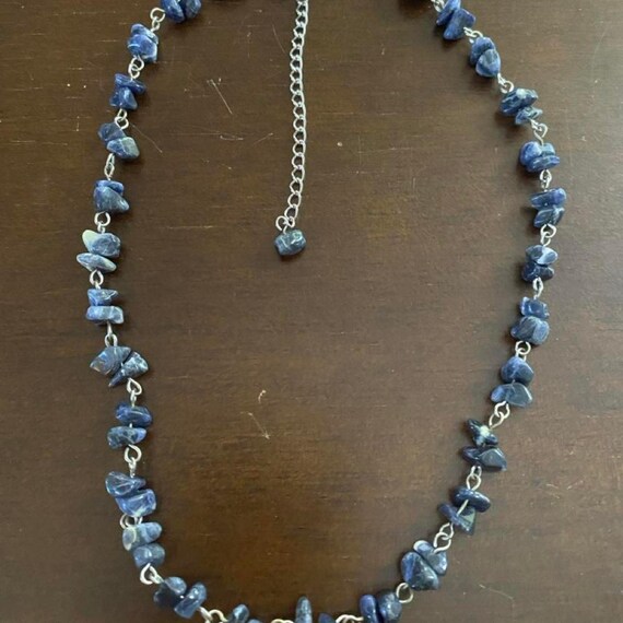 Deep blue natural lapis lazuli chips lighter calcite veining  natural variations